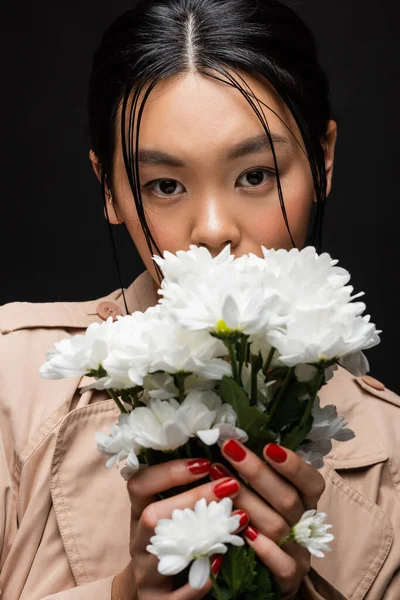 Stylish Asian Woman Trench Coat Covering Face Flowers Isolated Black — Stock Photo, Image