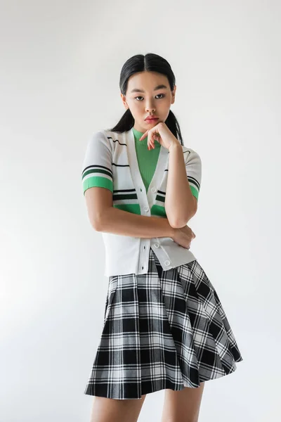 Stylish Asian Woman Checkered Skirt Looking Camera Isolated Grey — Stock Photo, Image