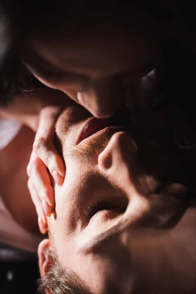 Close up view of young couple kissing with closed eyes — Stock Photo