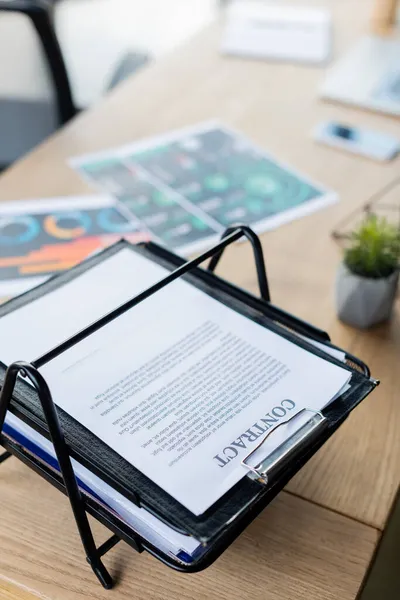 High angle view of contract on paper tray on table in office — Stock Photo