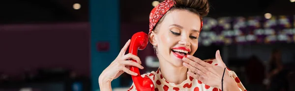 Happy pin up woman holding retro handset in cafe, banner — Stock Photo