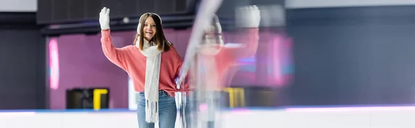 Happy woman waving hand on ice rink, banner — Stock Photo