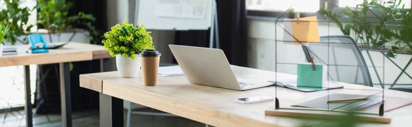 Devices near paper cup and documents in office, banner — Stock Photo