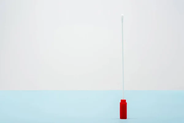 Top view of test stick on blue and grey background, omicron variant concept — Foto stock