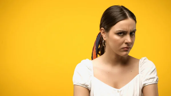 Offended woman in blouse looking at camera isolated on yellow — Photo de stock