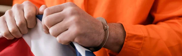 Partial view of convicted man in handcuffs tearing usa flag, justice concept, banner — Stock Photo