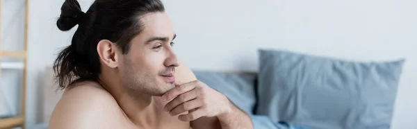 Smiling and shirtless man thinking at home, banner — Stock Photo