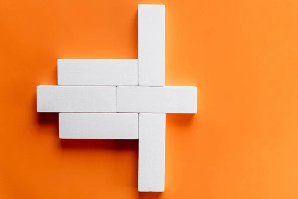 Top view of white rectangular form blocks on bright orange background — Stock Photo