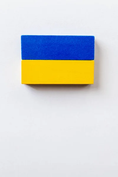 Top view of blue and yellow blocks on white background with copy space, ukrainian concept — Stock Photo