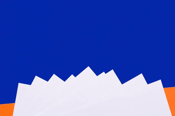 Decorative paper mountains on blue background with copy space — Stock Photo