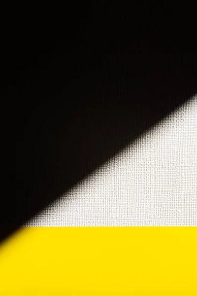 Textured white, black and yellow background with copy space — Stock Photo