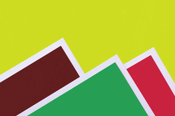 Decorative mountains from colored paper on bright green background — Stock Photo