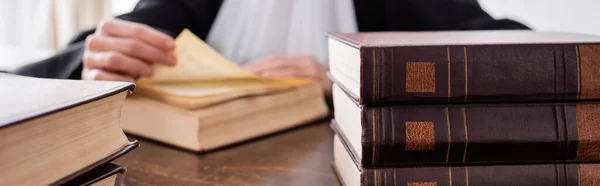 Close up view of books near cropped prosecutor on blurred background, banner — Fotografia de Stock