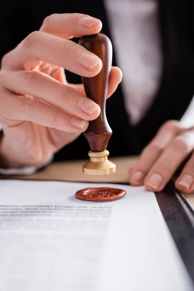 Close up view of cropped notary stamping contract with wax seal — Fotografia de Stock