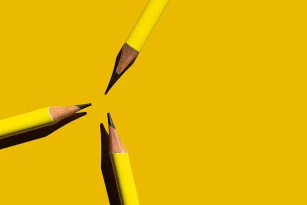 Flat lay with sharp pencils on yellow background — Stock Photo