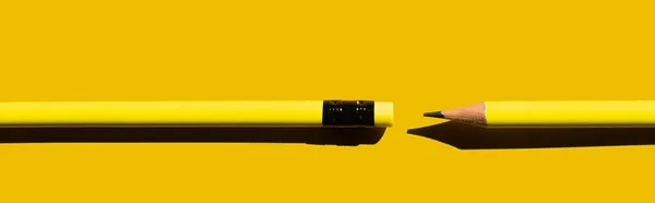 Top view of sharp pencils and eraser on yellow background, banner — Stock Photo