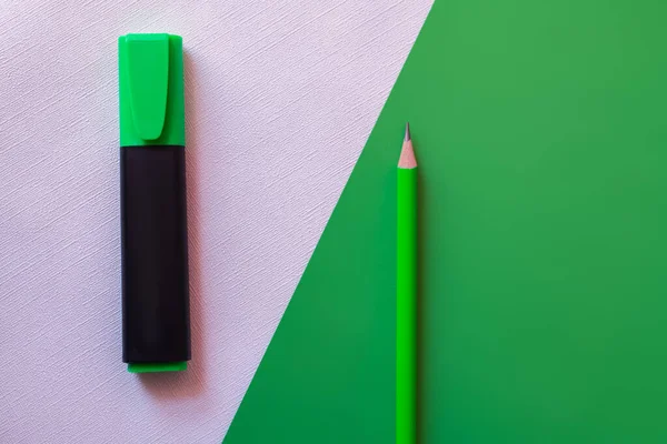Top view of pencil and marker pen on green and while — Stock Photo