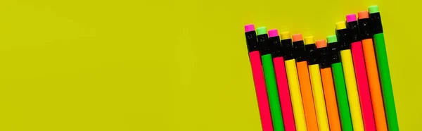 Top view of pencils with erasers on green background, banner — стоковое фото