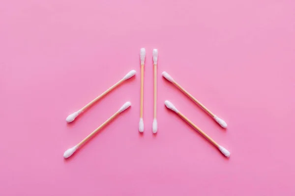 Top view of six ear sticks on pink background — Foto stock