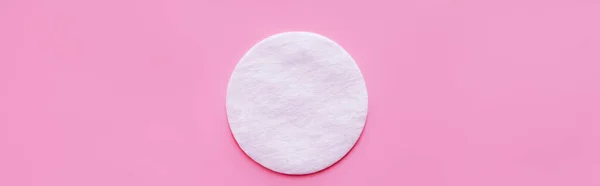 Top view of cosmetic cotton pad on pink background, banner — Stockfoto