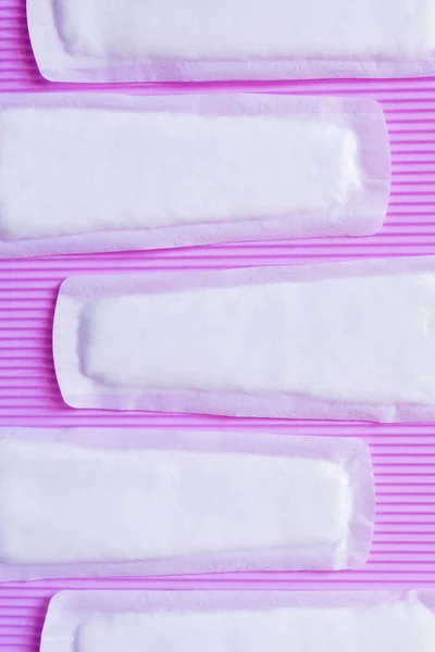 Top view of soft breathable panty liners on textured violet background — Foto stock