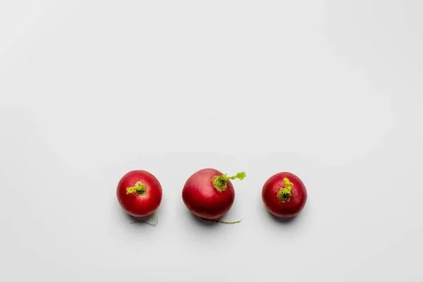 Top view of organic radishes on white background flat lay — Stock Photo