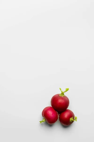 Top view of radishes on white background with copy space — Stock Photo