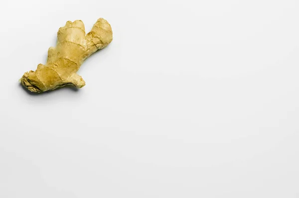 Top view of organic ginger on white background with copy space — Stock Photo