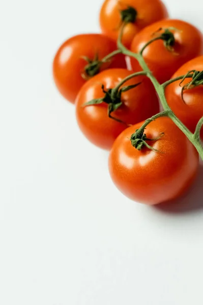 Close up view of fresh cherry tomatoes on white background — Stock Photo