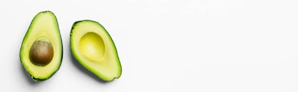 Top view of fresh cut avocado on white background with copy space, banner — Stock Photo