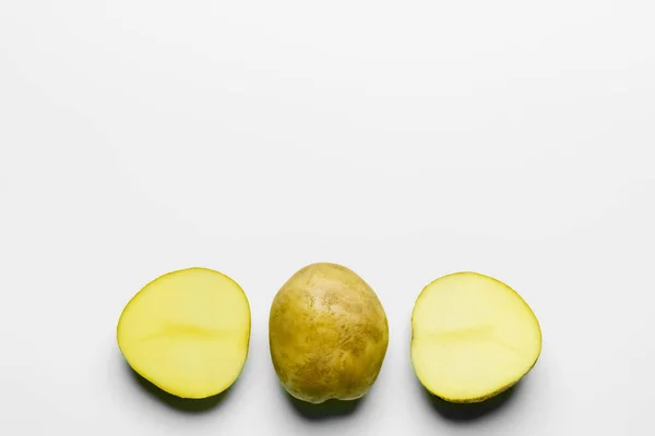 Top view of fresh potatoes on white background — Stockfoto