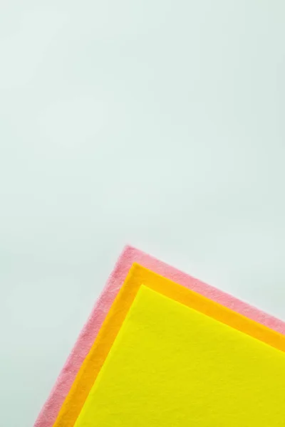 Top view of bright and multicolored dishrags isolated on grey with copy space — Stock Photo