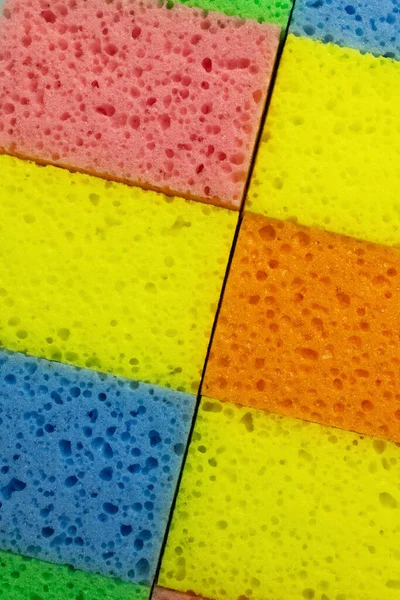 Close up of multicolored porous sponges, top view — Stock Photo