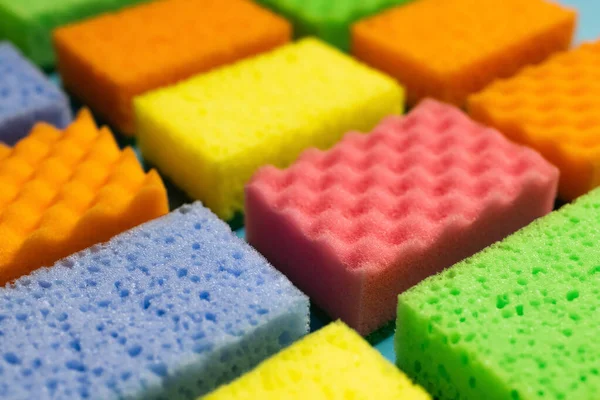 Close up view of different multicolored washcloths on blurred background — стоковое фото