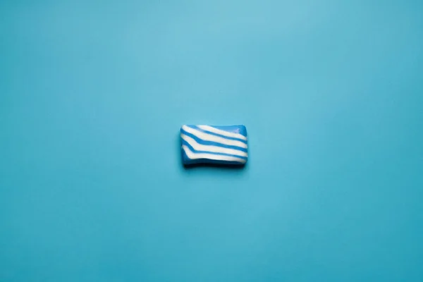 Top view of striped bath soap on blue background with copy space — Stock Photo