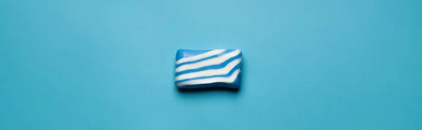 Top view of blue and white bath soap on blue background, banner — Stock Photo