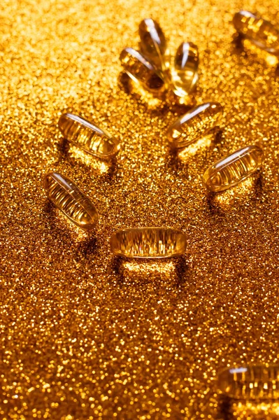 High angle view of jelly supplement capsules on shiny background — Stock Photo