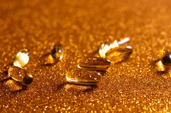 Close up view of supplement jelly capsules on shiny background — Stock Photo