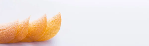Stacked and fried potato chips on white background, banner — Stockfoto