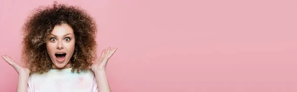 Amazed woman looking at camera isolated on pink, banner — Stock Photo