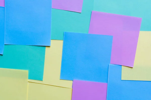 Top view of backdrop with multicolored paper cards — Stock Photo