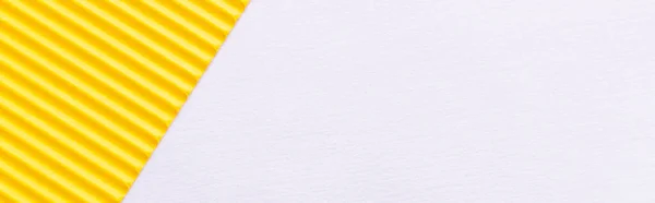 Top view of bright yellow textured paper on white background, banner — Stock Photo