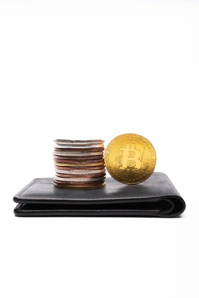 KYIV, UKRAINE - APRIL 26, 2022: Close up view of different bitcoins on wallet on white background — Stock Photo