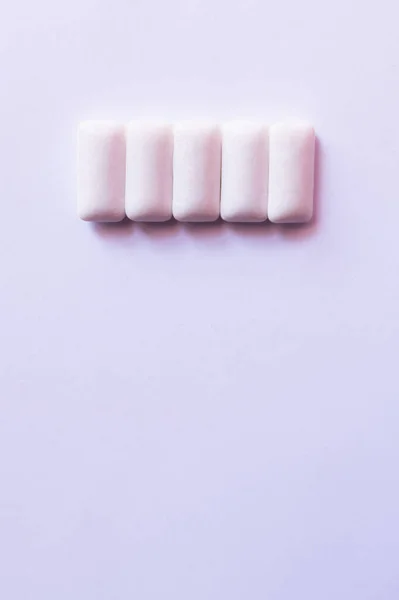 Top view of chewing gums on white background with copy space — Stock Photo