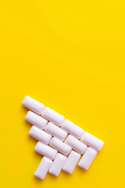 Flat lay with chewing gums on yellow background with copy space — Stock Photo