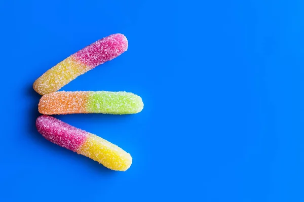 Top view of jelly sweets on blue background — Stock Photo