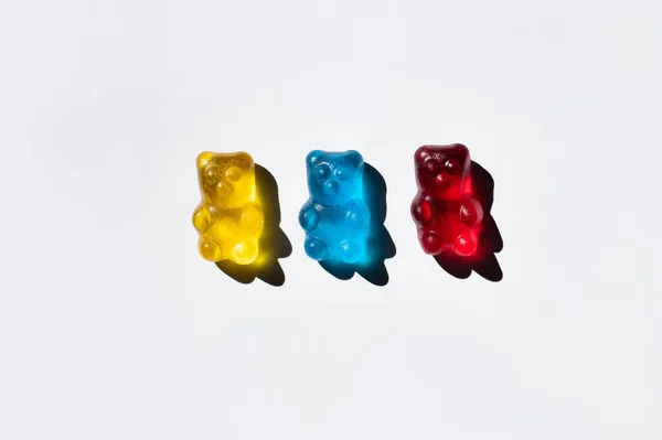 Top view of colorful gummy bears on white background — Stock Photo