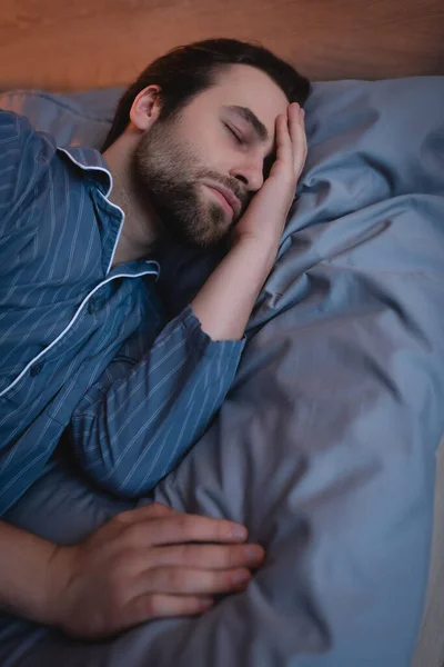 Bearded man suffering from insomnia on bed at home — Foto stock