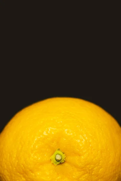 Close up view of orange in peel isolated on black — Photo de stock