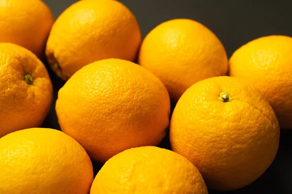 Close up view of tropical oranges isolated on black - foto de stock